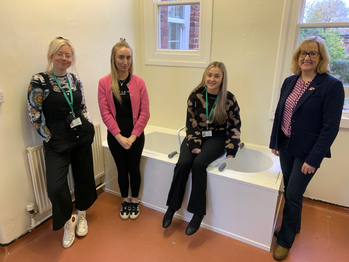 L-R: Third-year OT students Jessica Moore and Niamh Sweeney watching a bathroom demonstration led by Cumberland Council OT Sally Brown (seated) and Susie Wilson, (right) from University of Cumbria, at the university’s Fusehill Street on-campus clinical skills area