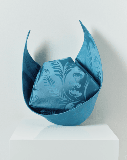 Image of a striking blue cornette on a mannequin.