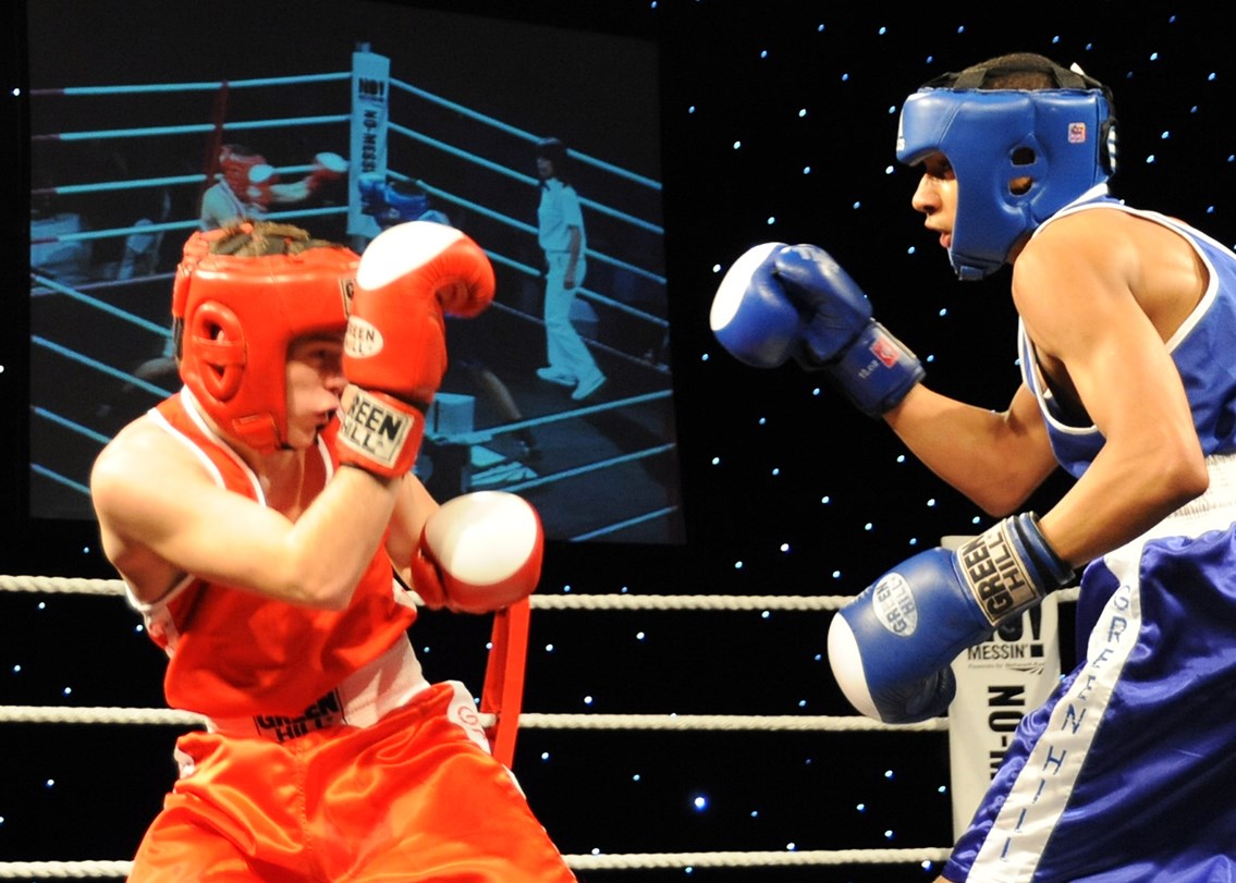 Zelfa Barrett on way to victory: 18 year old Zelfa Barrett (in blue) from Moston and Collyhurst Boxing Club on his way to deafeting Andrew Griffin of Bolton Elite at the Tri-Nation boxing competition.