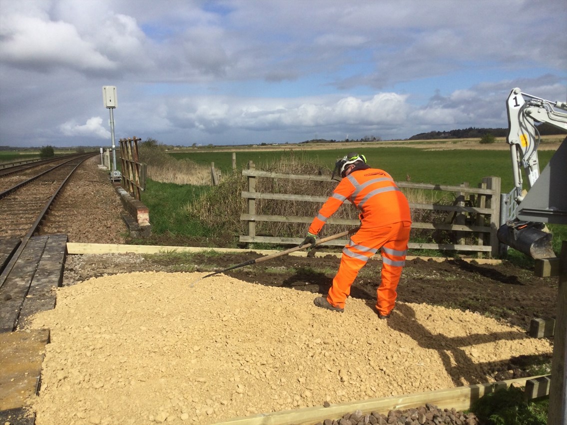 Installing a new, less bumpy approach to a rural level crossing around Somerleyton