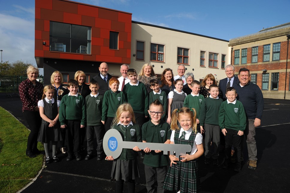 Cllr Reid with Cllrs Cowan, Linton, Jones, Chief Executive Eddie Fraser, Linda McAulay-Griffiths, HT Tina Gaitens and children and young people from Crosshouse PS and Communication Centre