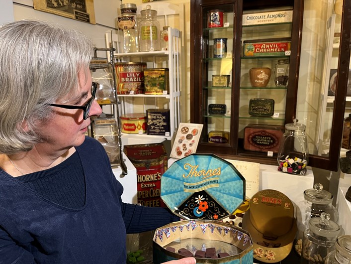 The Power of Persuasion: Kitty Ross, Leeds Museums and Galleries' curator of social history, with some of the vintage confectionery on display as part of The Power of Persuasion at Abbey House Museum.