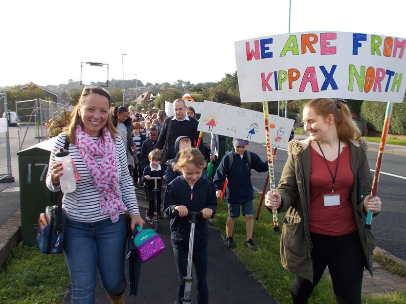 Kippax pupils put their best foot forward for car free day: childrenwalkingwithbanners.jpg