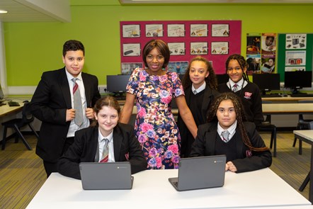 Cllr Michelline Ngongo with pupils and the Chromebook laptops at Arts & Media School Islington