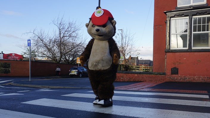 Mascot Kerby using the new zebra crossing at Ingram Road Primary School: Mascot Kerby using the new zebra crossing outside Ingram Road Primary School.