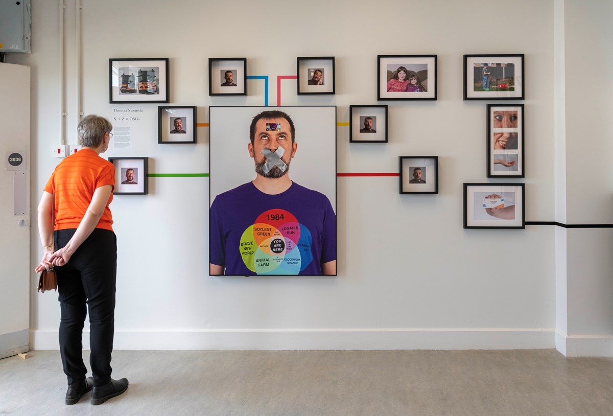 A visitor taking in the artwork of Thomas Swegsda at the University of Cumbria Institute of Arts Creative Community 2023 Undergraduate Degree Show, during a Private View event held on 2 June 2023 at the university's Brampton Road campus, Carlisle