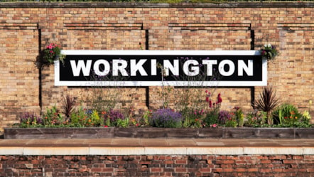 Image shows Workington station signage