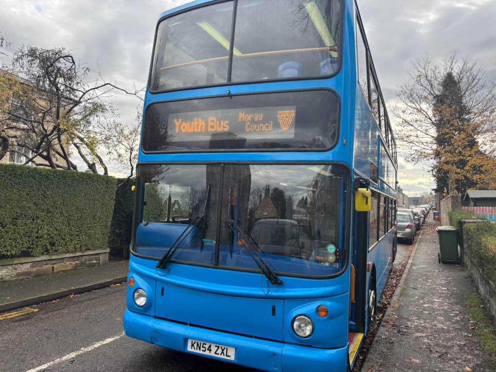 A photo of the AYE bus parked up in Elgin. The sign reads 'Youth Bus' and 'Moray Council'