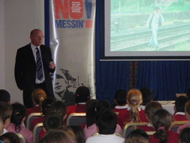 Kids get the No Messin' message: Terry Hawkins, Network Rail's community safety manager, shows a hard-hitting DVD about the dangers of playing on the railway