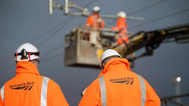 Passengers urged to plan ahead as Network Rail trials mid-week engineering work on East Coast Main Line: Stock photo of overhead line engineers