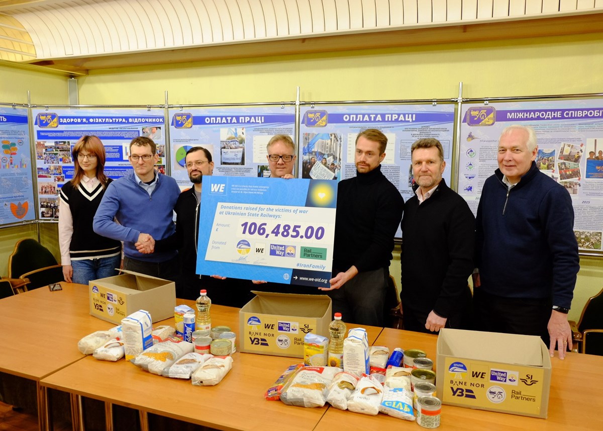 Rail Partners and WE AID delegation presents a cheque showing the amount raised by partners to Oleksii Semerun, leader of UZ’s main labour union the Trade Union of Railway Workers and Transport Builders of Ukraine (third from left), with Nick Brooks, ALLRAIL - co-chair of the Global Ukraine Rail Tas