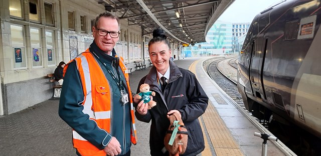 CrossCountry train conductor passing monkey over to Great Western Railway at Bristol Temple Meads: CrossCountry train conductor passing monkey over to Great Western Railway at Bristol Temple Meads