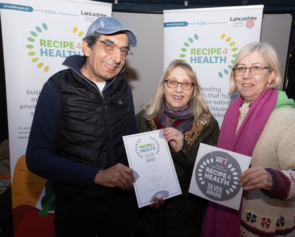 Amphora staff are presented with the Silver award by the Mayor