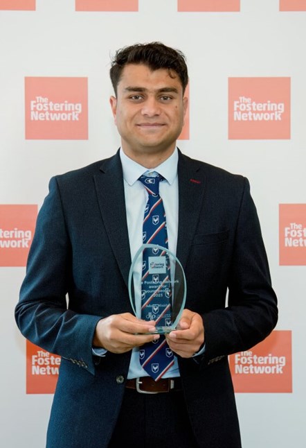 Adnan with his Fostering Excellence Award. Photograph by The Fostering Network.