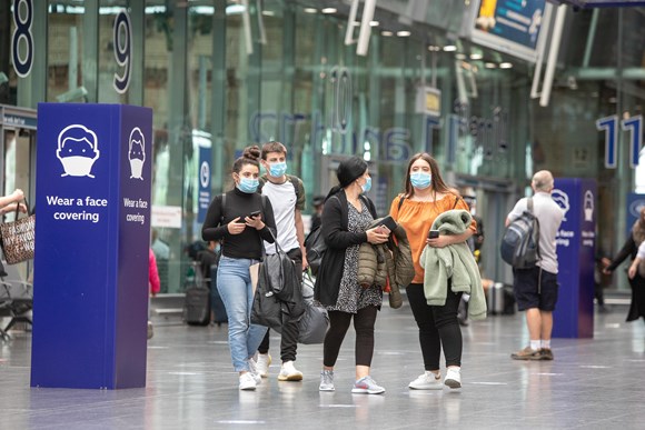 People wearing face coverings at Manchester Piccadilly station