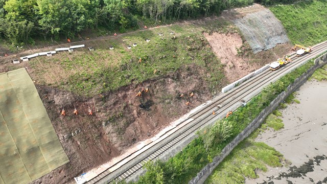 Wide shot of rope workers and rock bolts SERP 2023: Wide shot of rope workers and rock bolts SERP 2023