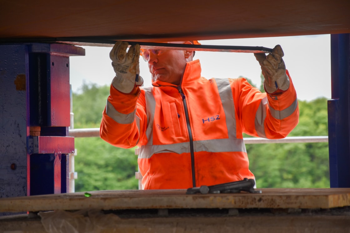 Non-stick pads being inserted under the deck beam during the M6 South viaduct first launch June 2025
