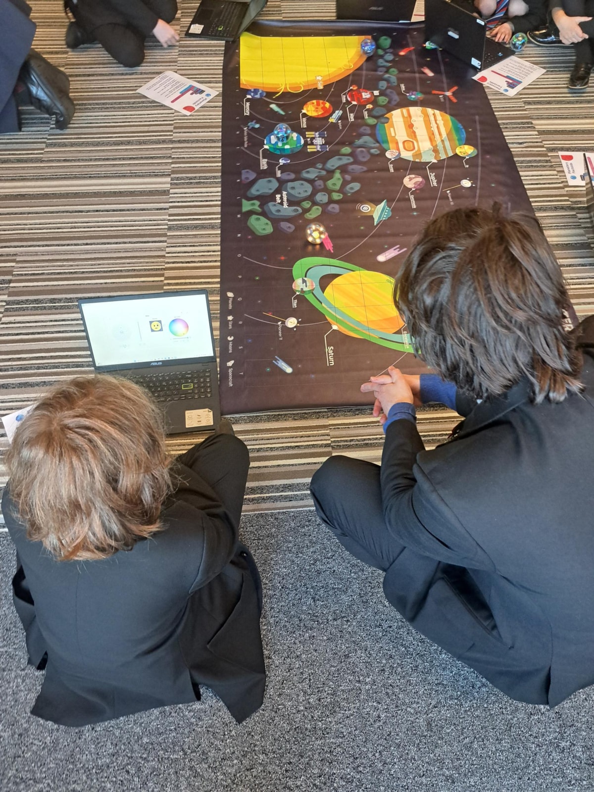 County Councillor Matthew Salter, cabinet member for Education and Skills, discusses Sphero BOLT coding with a pupil at Lancaster and Morecambe MEGA Hub