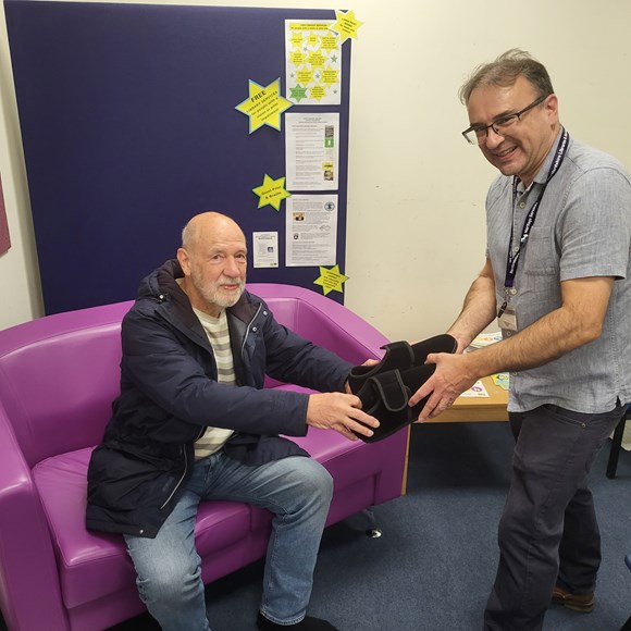 Claim your free slippers in Hertfordshire libraries: Hertfordshire resident at a slipper swap event