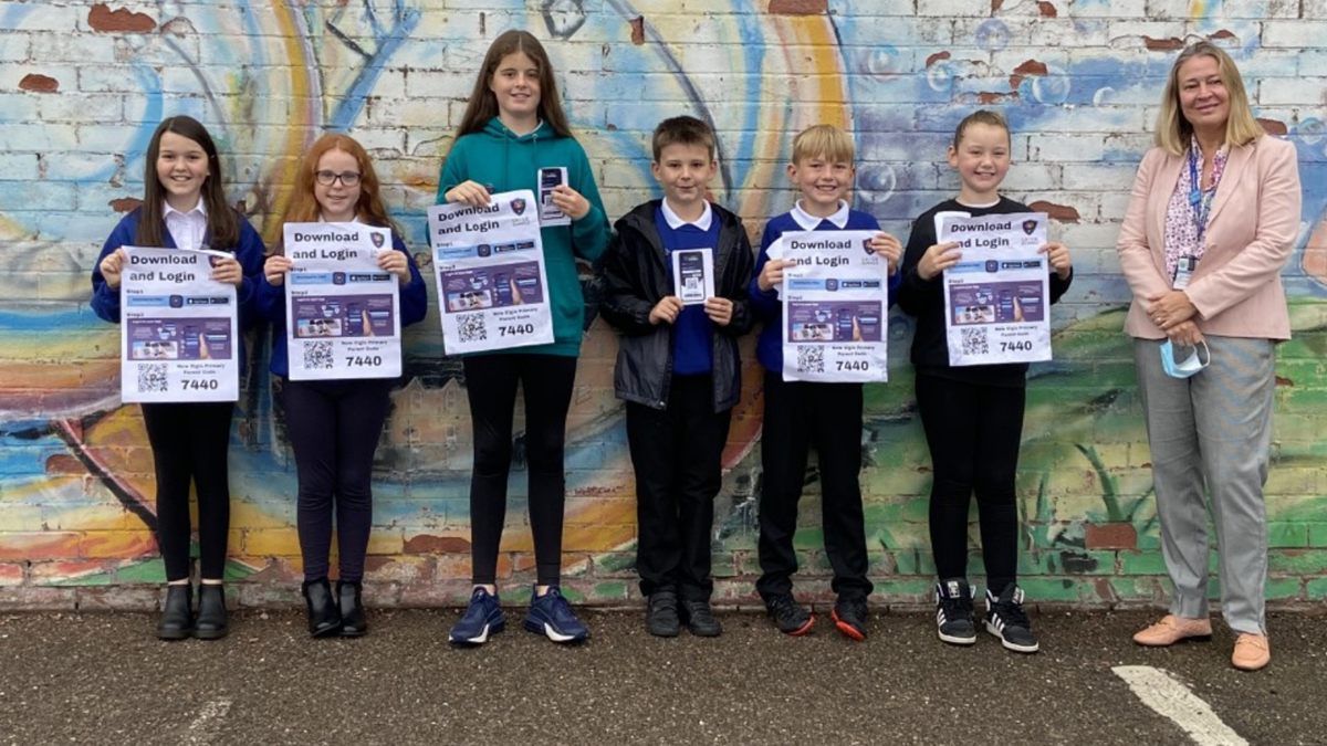 New Elgin Primary's Digital Leaders (L-R: Lucia, Cembra, Zara, Tyler, Mitchell and Marley) with Head Teacher, Elaine Milne