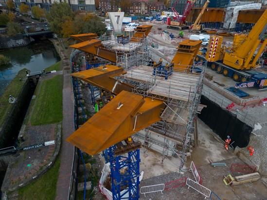 Two steel tripods next to Digbeth Canal