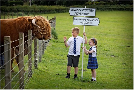 Molly (5) and Adam (8) Cook from Bun-sgoil Beinn Chamshroin (Mount Cameron Primary Gaelic School) meet Lewis the Bull at the National Museum of Rural Life, East Kilbride as they launch the attraction’s new bilingual family trail. Named after Lewis, the trail introduces children to Scottish farming objects and rural traditions and teaches English-speaking visitors some simple Gaelic words.-4