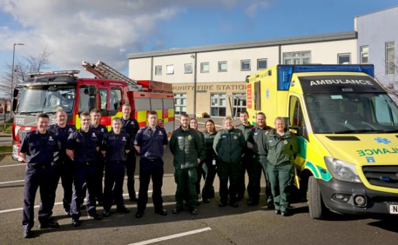 Teams from North East Ambulance Service and Tyne and Wear Fire and Rescue Service in front of Marley Park Community Fire Station