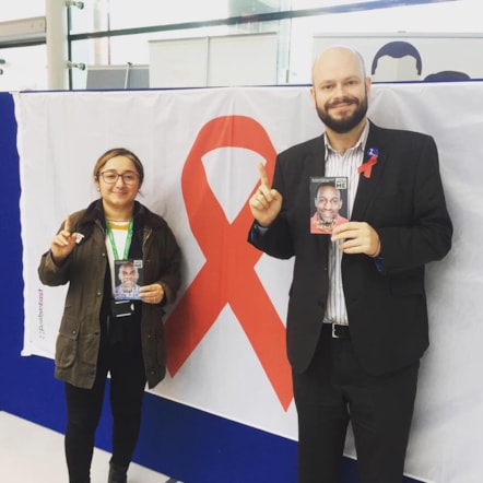 Cllr Feryal Demirci and Mayor Philip Glanville with the World AIDS Day flag on display at Hackney Service Centre given by Positive East