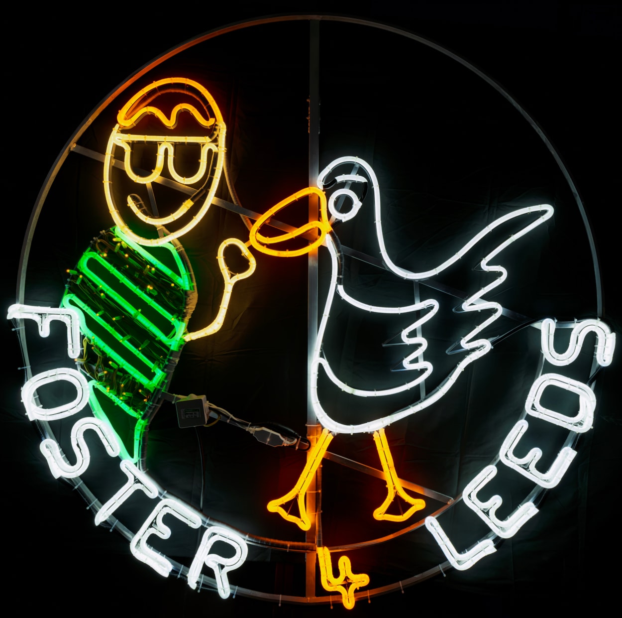 Foster 4 Leeds Light Night 5: The neon rope light created for Light Night Leeds based on a drawing by a 12-year-old boy in foster care, of feeding the ducks.