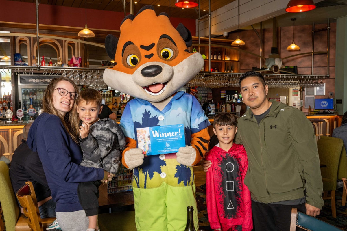 The Deang family and Rory the Tiger - winner of Haven x JDW One Million Meals Sold