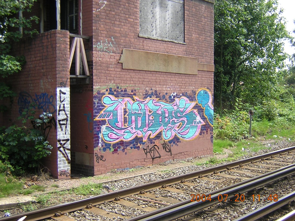 Graffiti vandalism on signal box - Chiswick, West London: Vandalism on a disused signal box in Chiswick, West London.
Photo taken May 2006.