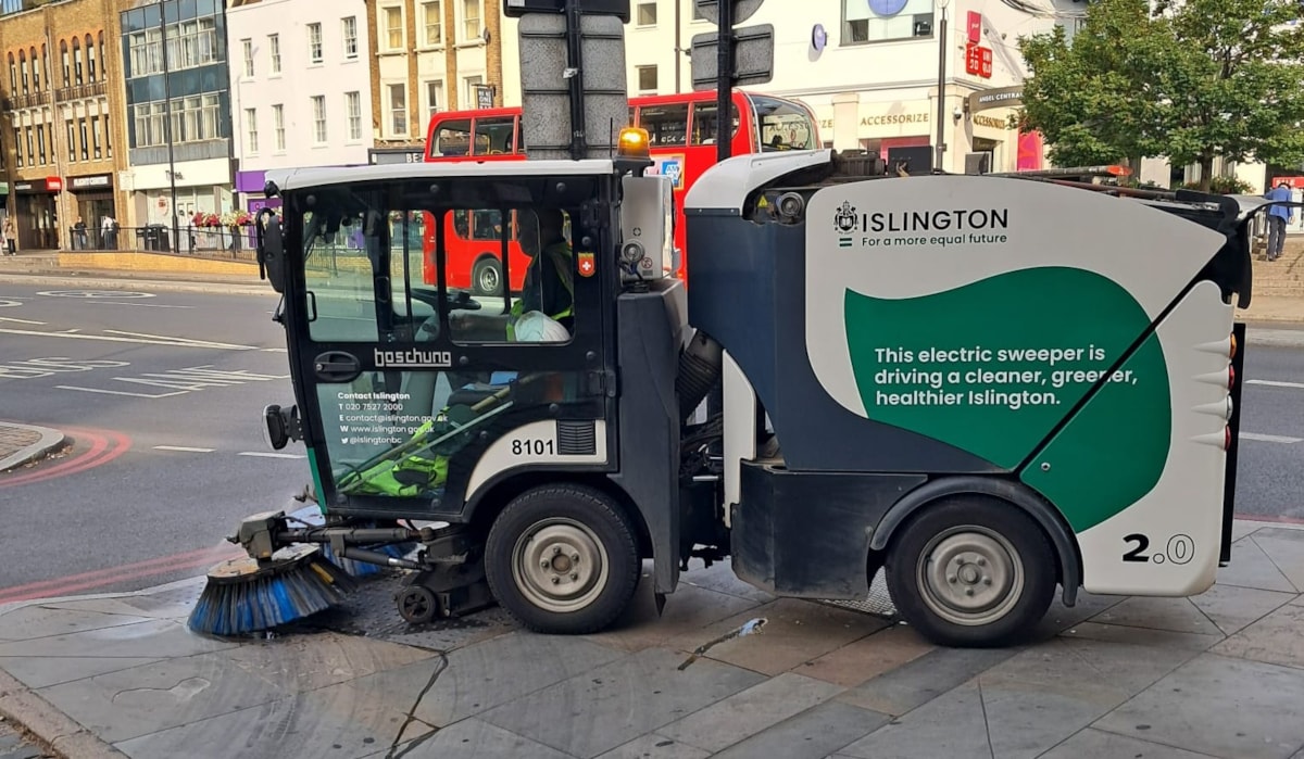 One of Islington Council's electric street sweepers out cleaning the streets in Angel
