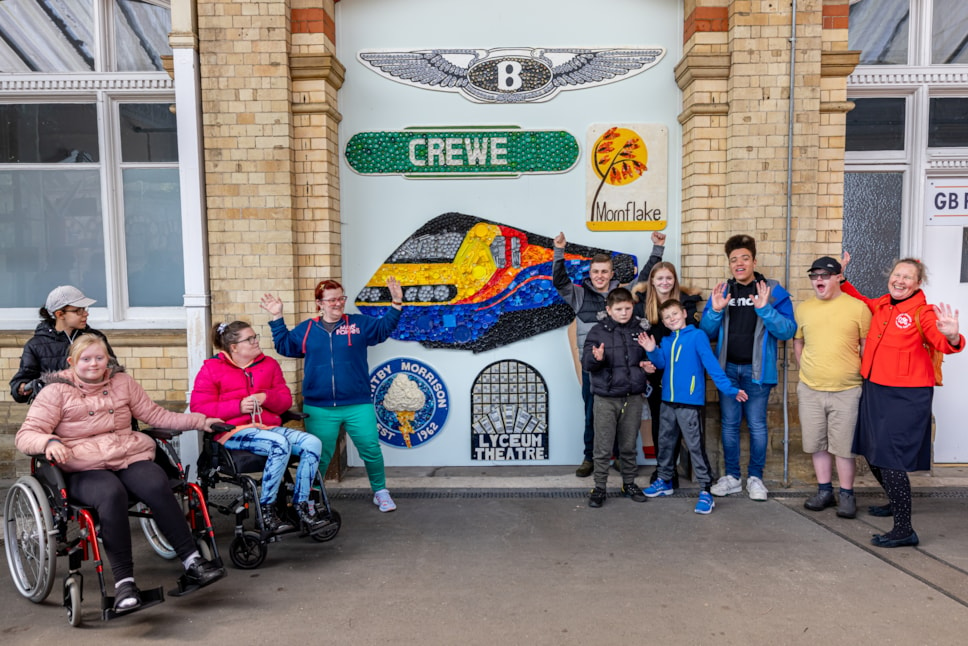 Children and young people from Cheshire Buddies with the art installation they created at Crewe station.