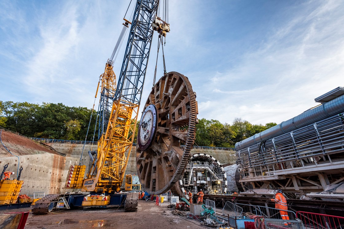 'Dorothy' TBM's giant cutterhead being lifted into place during reassembly