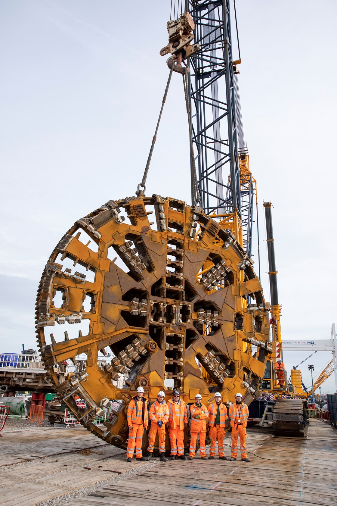 Members of the BBV team with the cutterhead before the lift