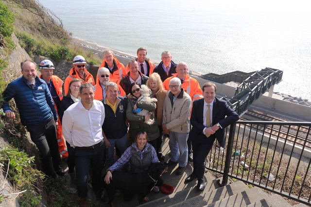 Dover - Shakespeare Beach: Network Rail, Costain and Kent County Council, MP Charlie Elphicke, Channel Swimmers, dog walkers and their dogs celebrate the opening of Shakespeare Beach and the new footbridge to it in Dover