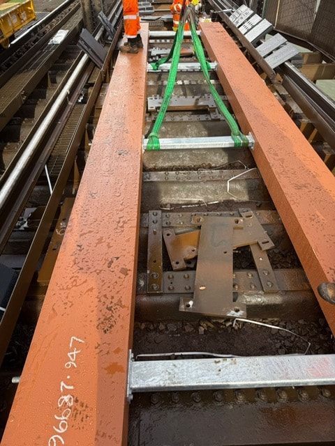 New wheel timbers being lifted in