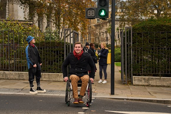 Olympic rowing champion, Captain Pete Reed OBE partners with TfL to introduce wheelchair user traffic light signals to represent disabled people ahead of International Day of Persons with Disabilities: TfL Image - Pete Reed OBE crossing the road 1