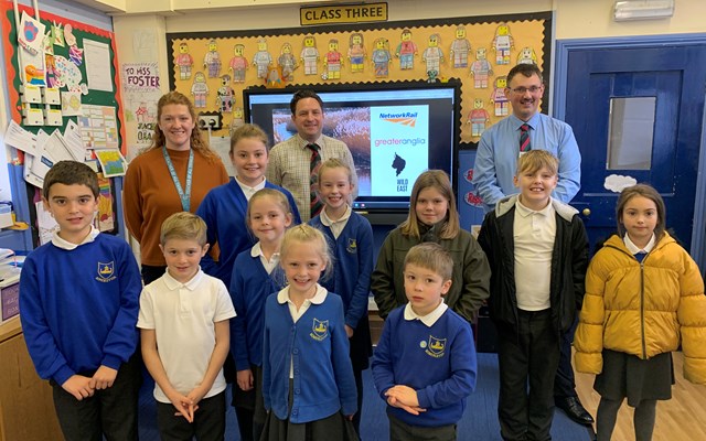 Senior Network Rail engineers Mark Walker and Liam Allen with children from Somerleyton Primary School and Class 3 teacher, Miss Foster