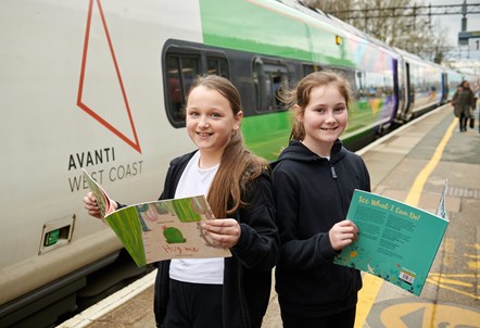 Jessica and Ella from Westfield Primary School in Runcorn with books donated by Avanti West Coast