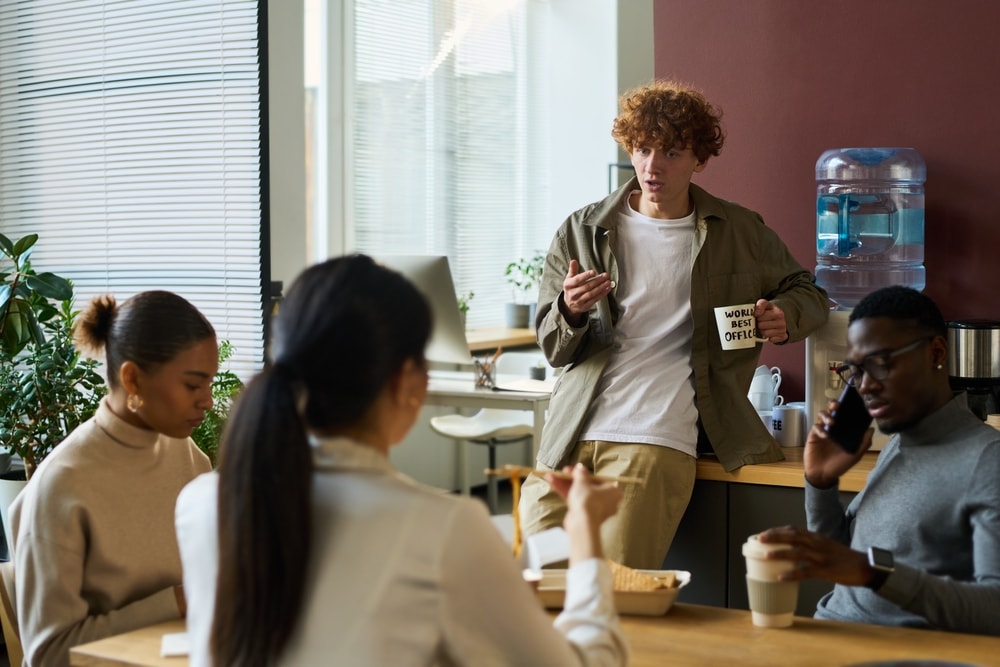 Image shows office workers in discussion