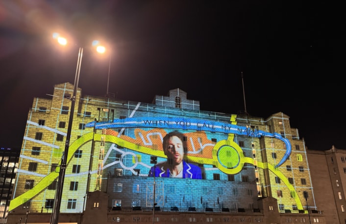 Call My Name, Call Me Home - imitating the dog with Hope & Social: A beautiful ode to memories of a life lived in Leeds took centre stage as one of the major projections at Light Night Leeds.

Transforming the façade of The Queens Hotel, Call My Name, Call Me Home combines song and story in a moving celebration of belonging and the places that shape a life.