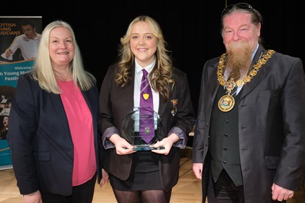 Provost Todd and Julie Hope present Charlie with her trophy