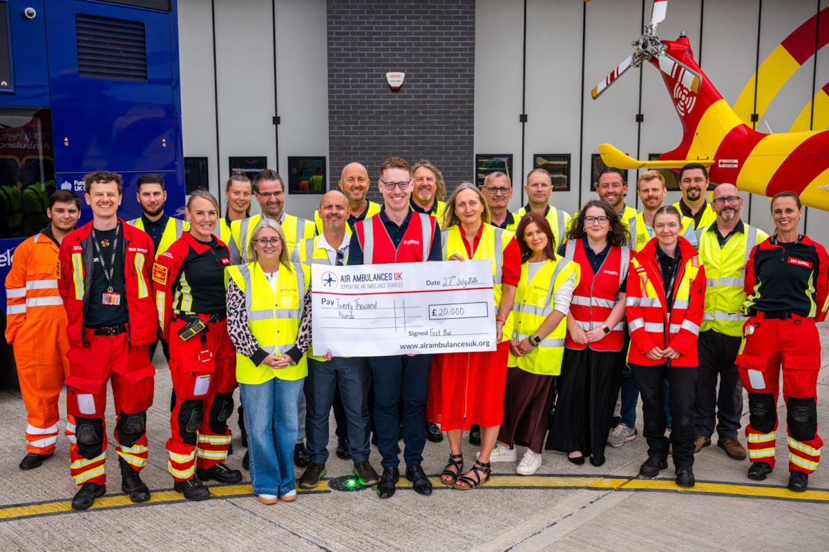 First Bus present cheque for £20,000 to Air Ambulances UK