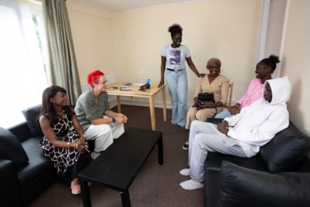 Dr Debbie Weekes-Bernard and Cllr Chapman speak with a resettled family
