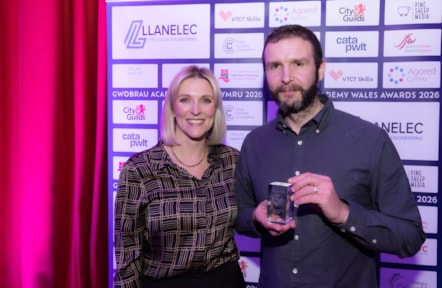 Bus driver apprentice award winner Dean Turner with Frances Lee from event sponsors Agored Cymru.