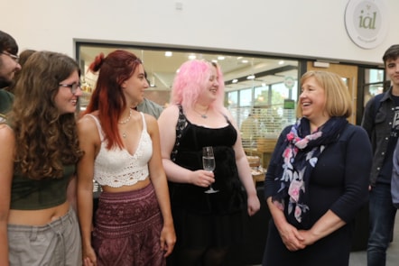 Lynne Neagle cabinet secretary for education meets successful students L-R: Kayleigh Coppell,  Zoe Bayley-Jones and Lauren Slawson during her visit to the Yale campus Wrexham