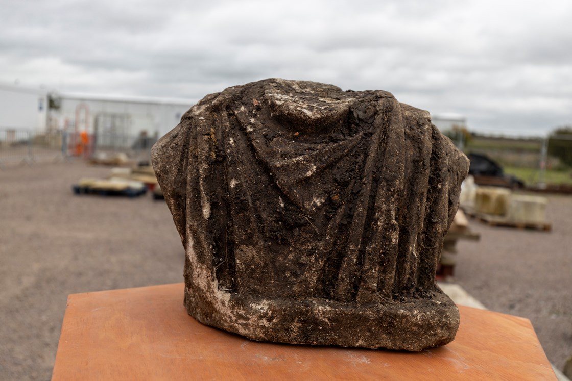 Torso of torso of Roman statue  - Artefacts from St Mary's Archaeological dig - Stoke Mandeville, Buckinghamshire-7: Torso of torso of Roman statue discovered during a HS2 archaeological dig at the site of old St Mary’s church in Stoke Mandeville, Buckinghamshire. The artefacts were found underneath the footprint of a Medieval church that was being excavated. 
Tags: Roman, Archaeology, Stoke Mandeville, Buckinghamshire