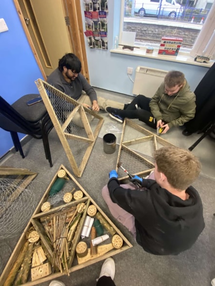 Image shows Year in Industry students creating'Bug Hotels' - 4