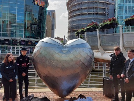 Young people from the Starting Point charity unveil the Armoured Heart sculpture, a symbol of peace and hope, in Reading